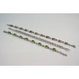 Peridot silver line bracelet, eight oval mixed cut peridot with chain and omega link spacers, length