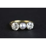 Pearl and diamond three stone 18ct yellow gold ring, the central grey pearl with green overtones,