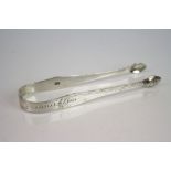 Pair of George III silver sugar tongs by Hester Bateman, blank cartouche, bright cut decoration,