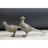 Pair of German silver pheasants modelled as a cock and hen, stamped 925 with German silver marks,