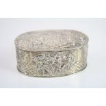 Continental silver oval trinket box, repousse town scene with dancers, lovers and musician to the