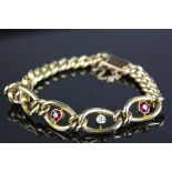 Edwardian ruby and diamond 15ct yellow gold curb link bracelet, three round faceted rubies, each