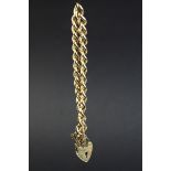 9ct yellow gold curb link bracelet with padlock clasp, each link hallmarked