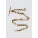 Late Victorian 15ct yellow gold trombone link watch chain, 15ct gold toggle and t bar, each link