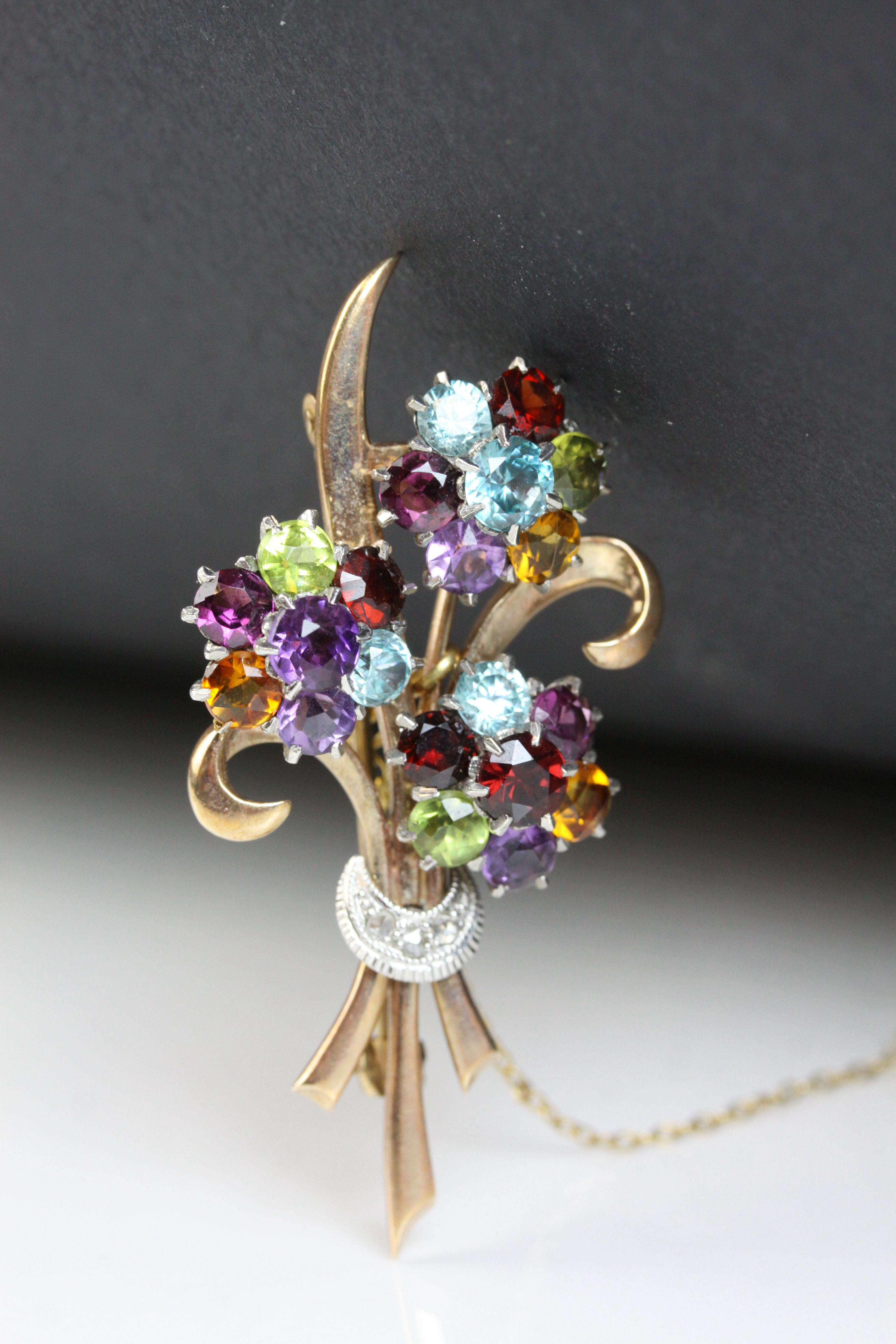 Multi-gemstone 9ct yellow and white gold floral spray brooch, the flower heads set with amethyst, - Image 3 of 7