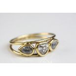 Beryl 18ct yellow gold ring, the goshenite heart shaped central stone with beryl leaf shaped stone