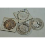 Four United States Of America One Troy Oz .999 silver bullion rounds of various designs.