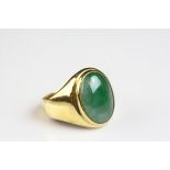 Jade 18ct yellow gold signet ring, the oval cabochon cut jade measuring approx 15mm x 11mm, rub over