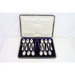 Edwardian cased set of twelve silver teaspoons together with a pair of silver sugar tongs,