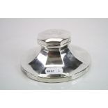 George V silver capstan inkwell of rounded octagonal form, the hinged lid engraved "From