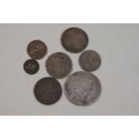 A small collection of early British milled silver coins to include a Charles II 1679 half crown