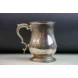 Edwardian silver footed mug, scroll handle with acanthus leaf, engraved initials to body, makers C S