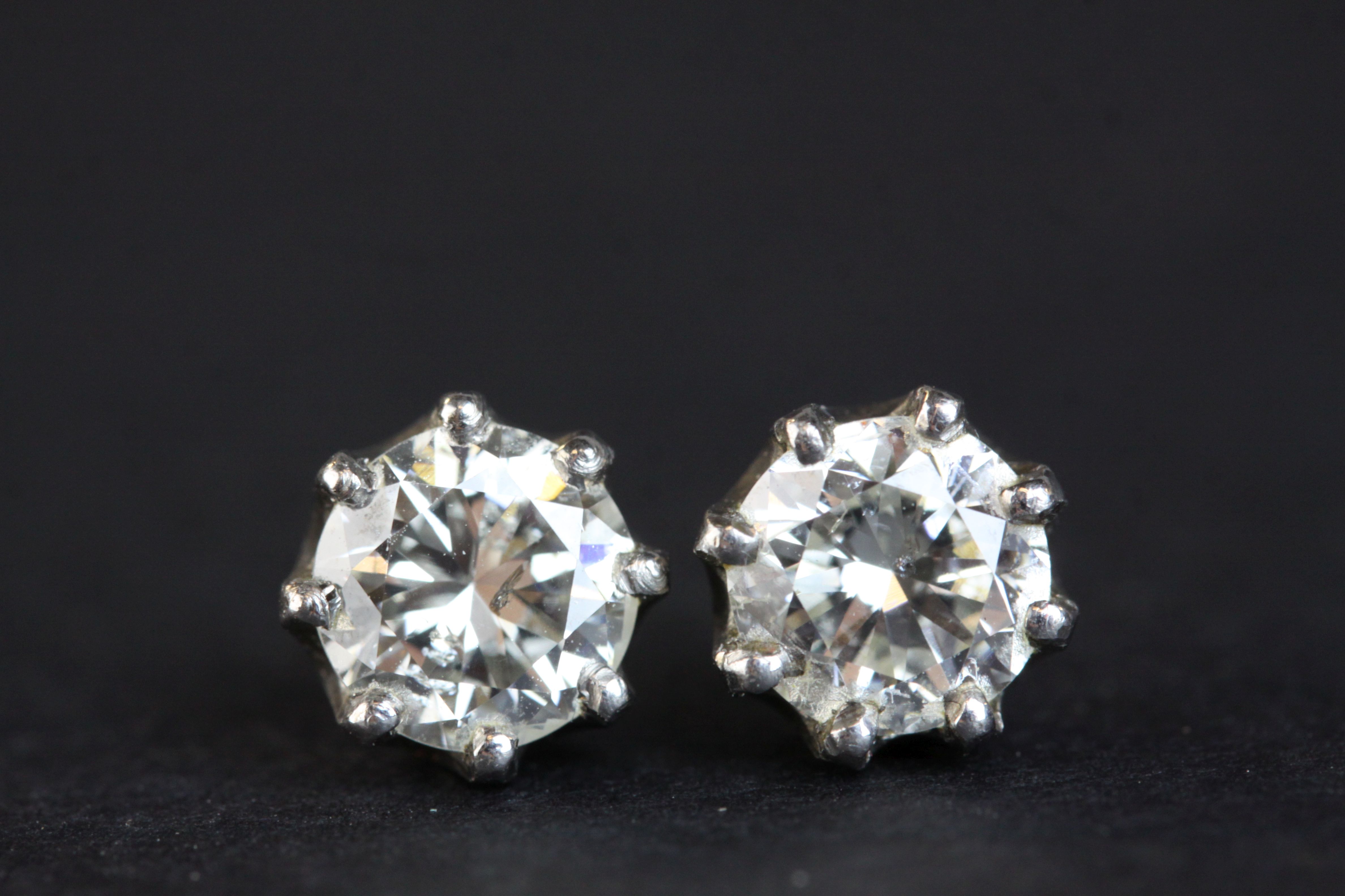 Pair of diamond solitaire stud earrings, each round brilliant cut diamond weighing approx 1.0 carat, - Image 5 of 8