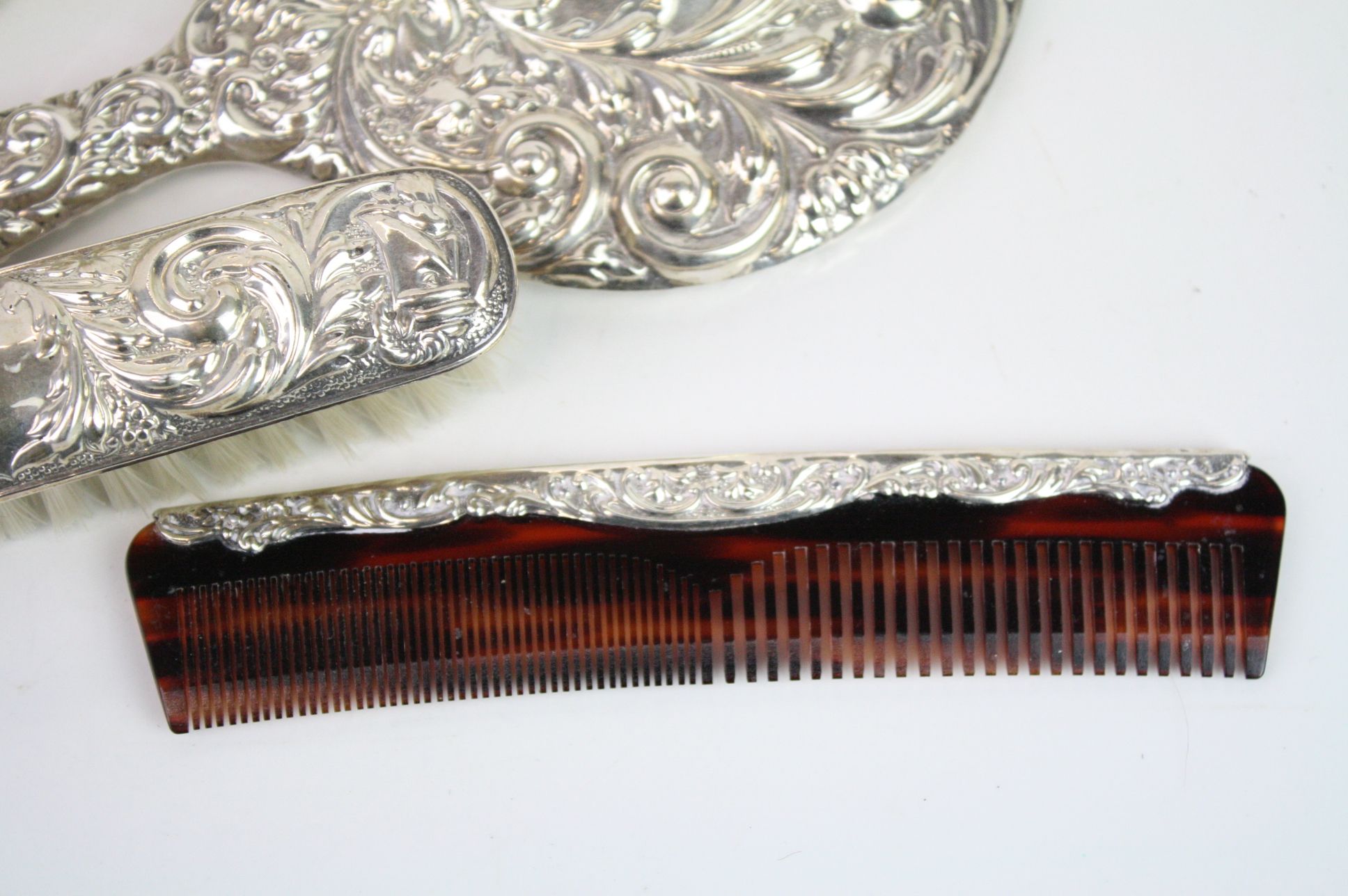 Four piece silver backed dressing table brush set comprising hair brush, hand mirror, comb and - Image 5 of 6