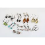 Ten pairs of gem set silver drop earrings to include citrine, amber, turquoise, tanzanite,