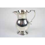 Silver sparrow beak cream jug, plain polished baluster form, scroll handle, height approx 9.5cm,