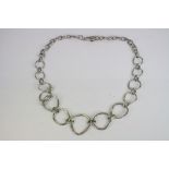 White metal irregular graduated link belt, t bar fastening, designers Pasha, length approximately