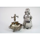 Victorian silver open salt cellar modelled as a shell raised on three feet modelled as fish, twin