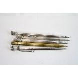 Four propelling pencils together with a brass propelling pencil (5)