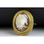 Victorian shell cameo yellow gold brooch depicting Medusa, rub over setting, fancy rope twist and