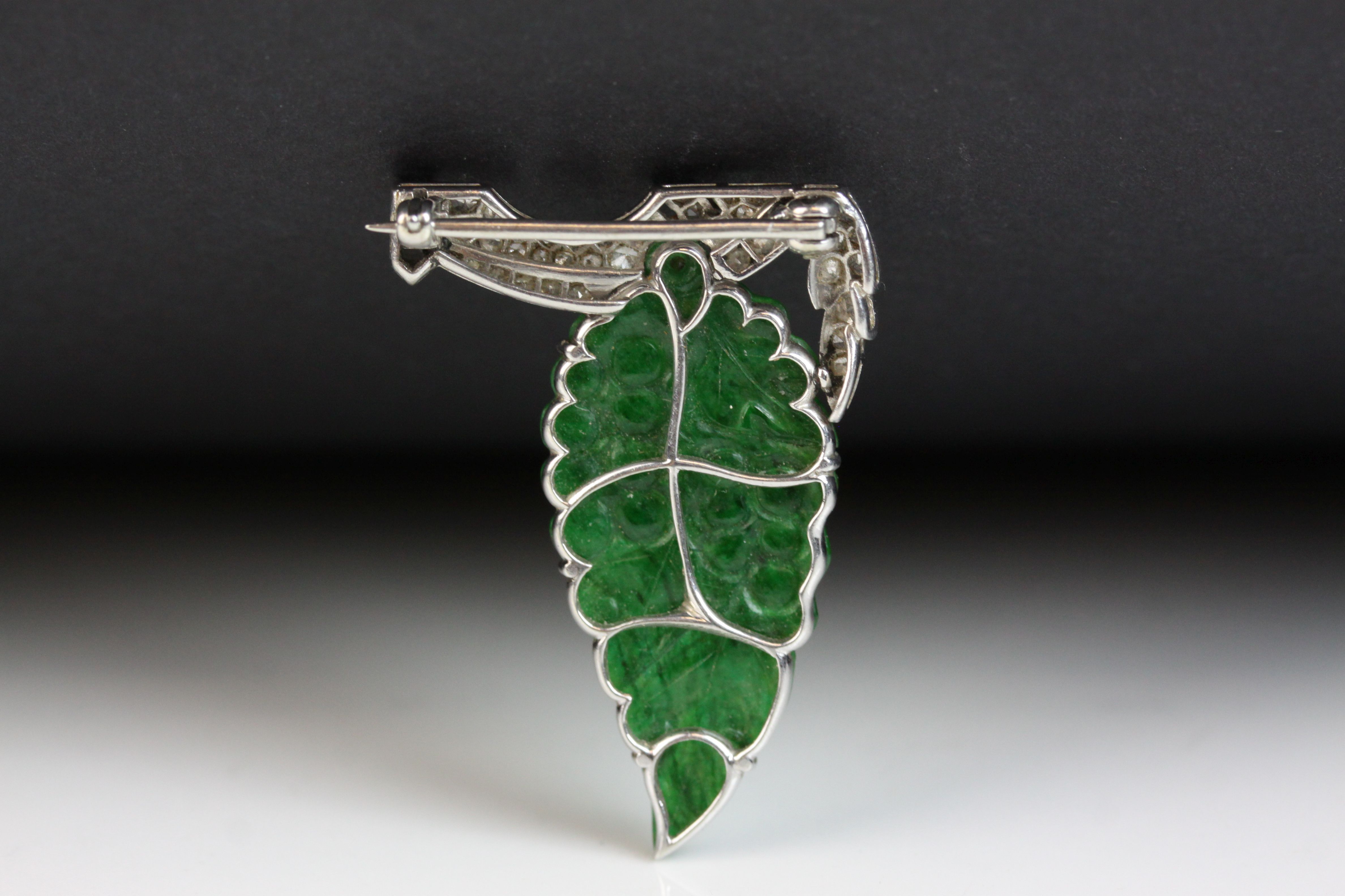 Art Deco jade type and diamond white metal brooch, carved grape and leaf design with small round - Image 2 of 3