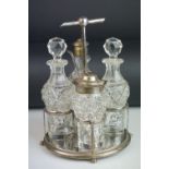 Late Victorian silver and cut glass four piece table cruet, comprising silver stand raised on four