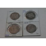 Four United States Of America silver half dollar coins to include a 1877 Seated Liberty half