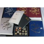 A collection of six Royal Mint Coin year sets to include 2003, 2007, 2002, 2001, 2000 and 2010,