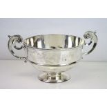 Silver twin handled pedestal bowl, double scroll handles with applied acanthus leaf decoration,