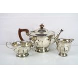 George VI silver three piece tea service, comprising tea pot, twin handled sugar bowl and milk