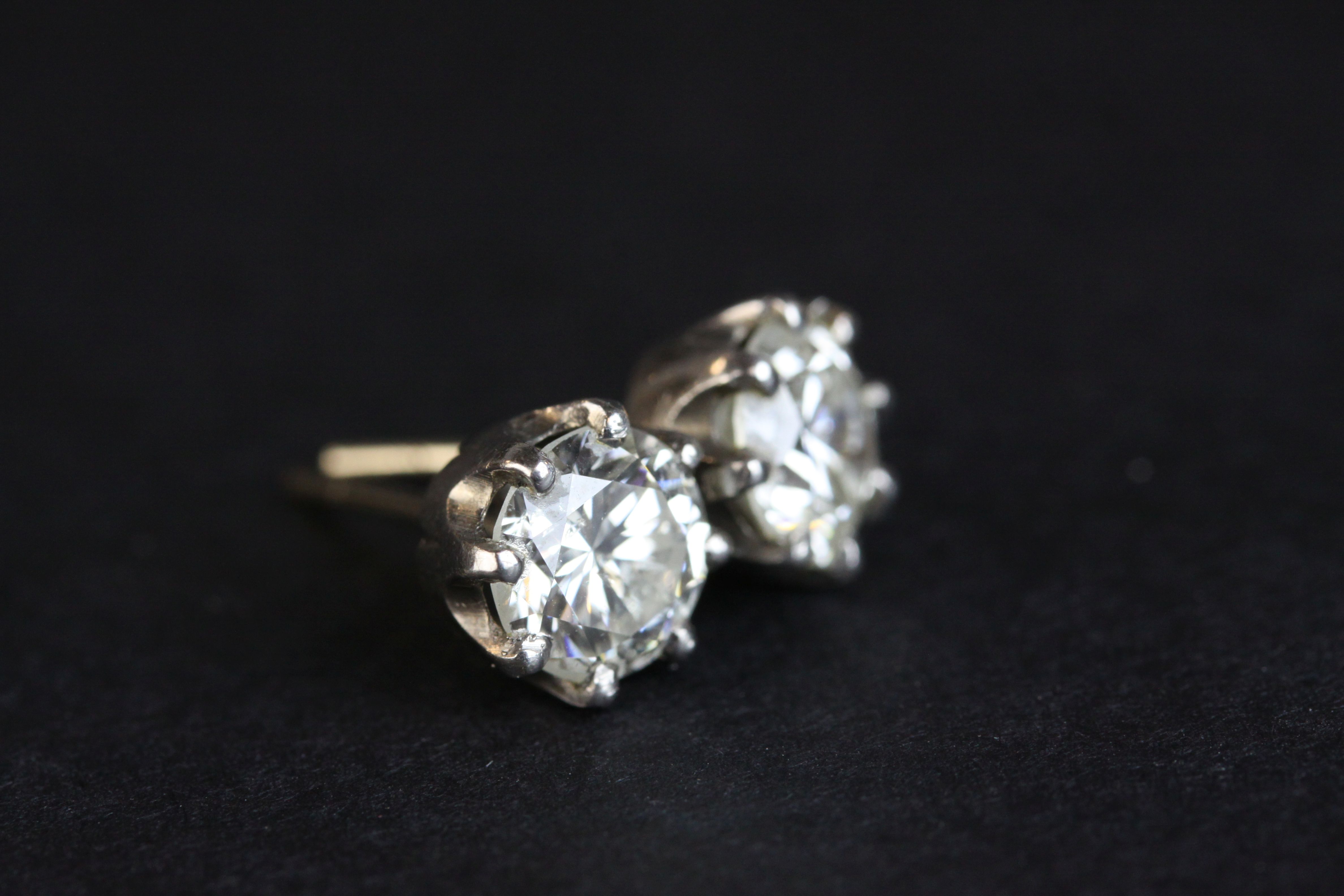 Pair of diamond solitaire stud earrings, each round brilliant cut diamond weighing approx 1.0 carat, - Image 2 of 8