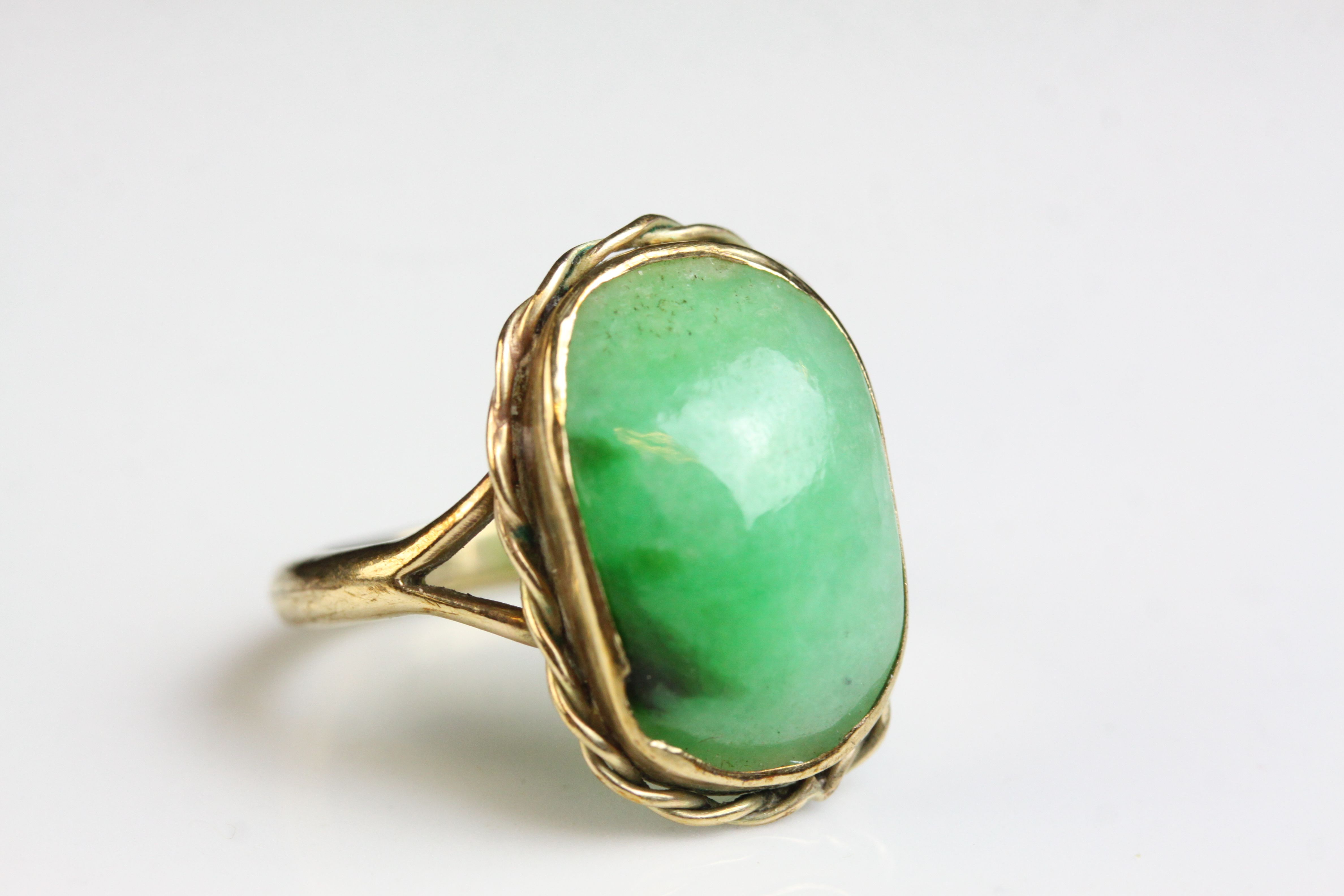 Jade 9ct yellow gold dress ring, the rectangular cabochon cut jade measuring approx 16mm x 10mm, rub