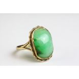 Jade 9ct yellow gold dress ring, the rectangular cabochon cut jade measuring approx 16mm x 10mm, rub