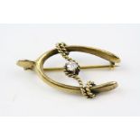 Late Victorian diamond 15ct yellow gold wishbone brooch, the central small round old cut diamond