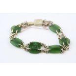 Nephrite jade 9ct yellow gold chain link panel bracelet, six jade panels, the central jade panel