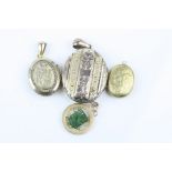 Four lockets and pendant comprising Jade rose metal pendant; yellow metal locket; Victorian garnet