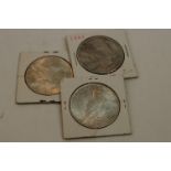 Three United States Of America silver Peace Dollar coins to include dates 1923, 1922 and 1925, all