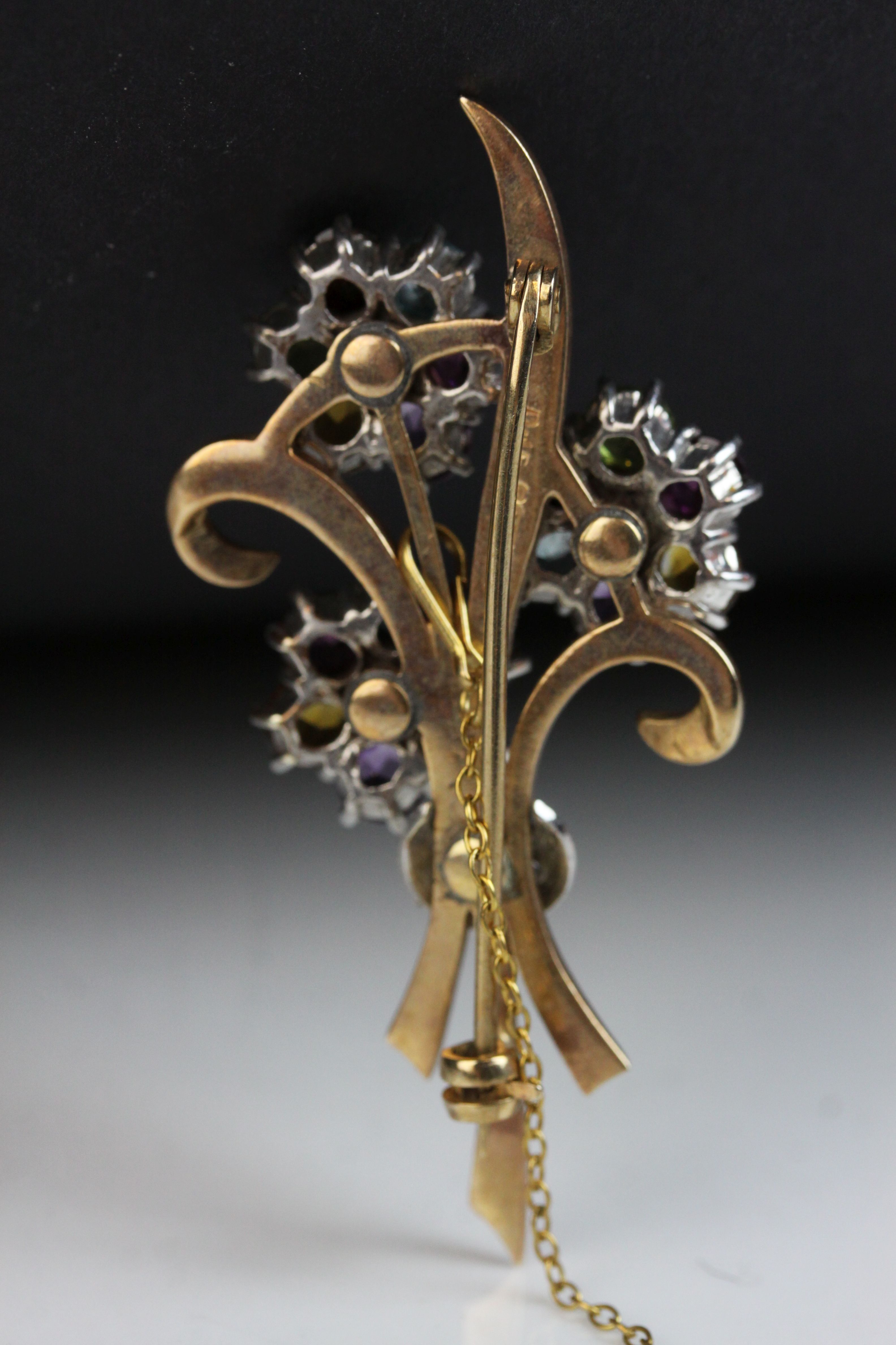 Multi-gemstone 9ct yellow and white gold floral spray brooch, the flower heads set with amethyst, - Image 6 of 7