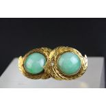 Pair of Chinese jade 18ct yellow gold stud earrings, round cabochon green jade with rub over