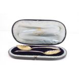 Pair of early Victorian silver gilt spoons, Old English feather pattern, scalloped bowl, makers