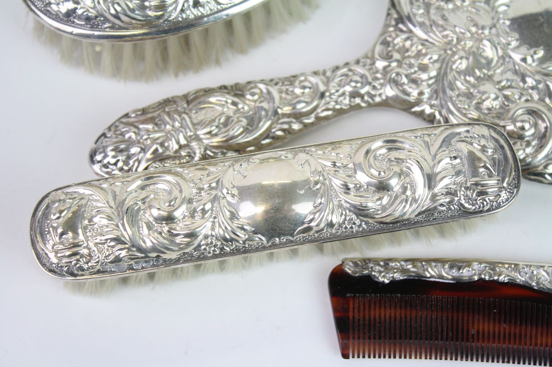 Four piece silver backed dressing table brush set comprising hair brush, hand mirror, comb and - Image 4 of 6