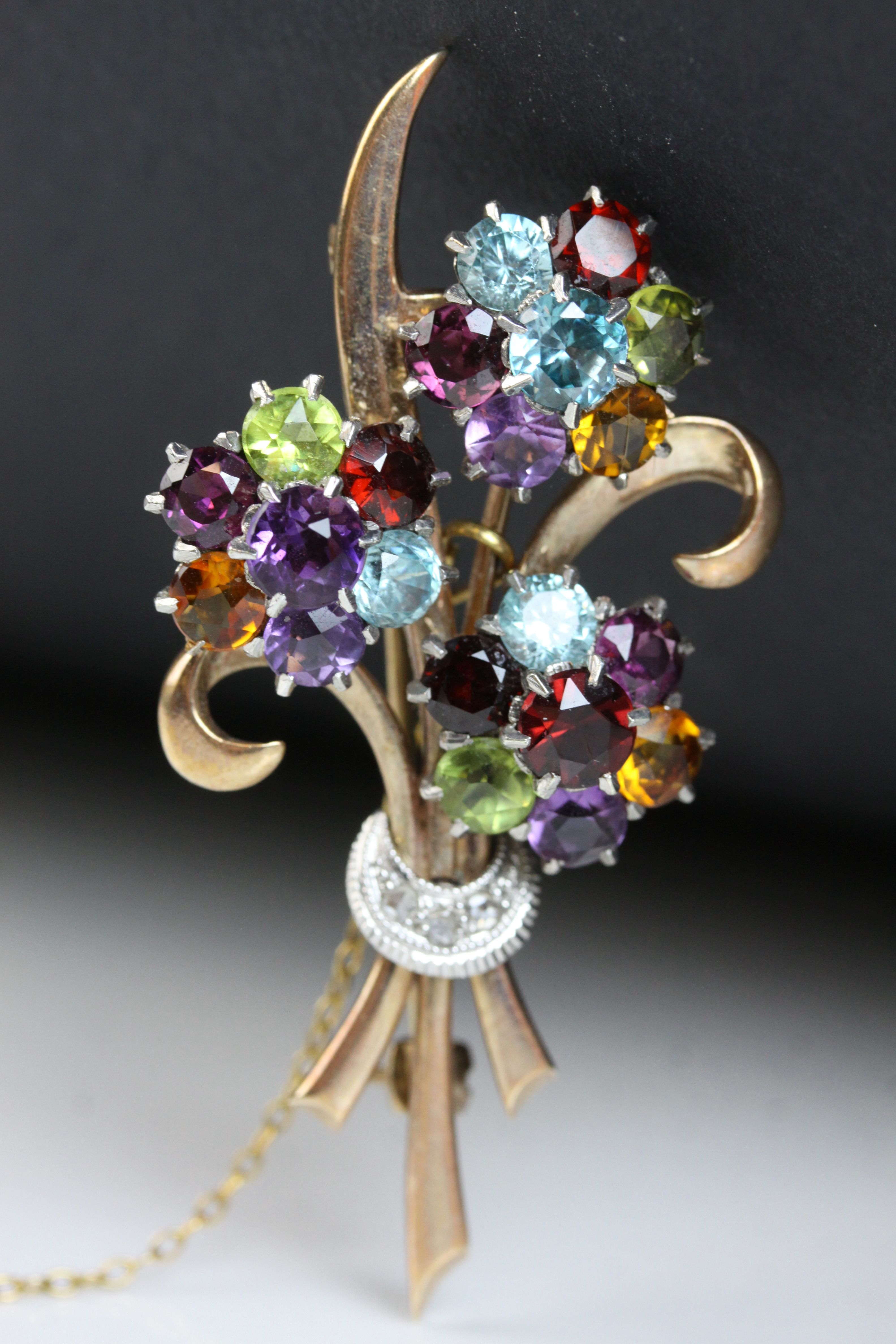 Multi-gemstone 9ct yellow and white gold floral spray brooch, the flower heads set with amethyst, - Image 5 of 7