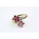 Ruby, pink sapphire and diamond 9ct yellow gold flower head crossover ring, six small round mixed