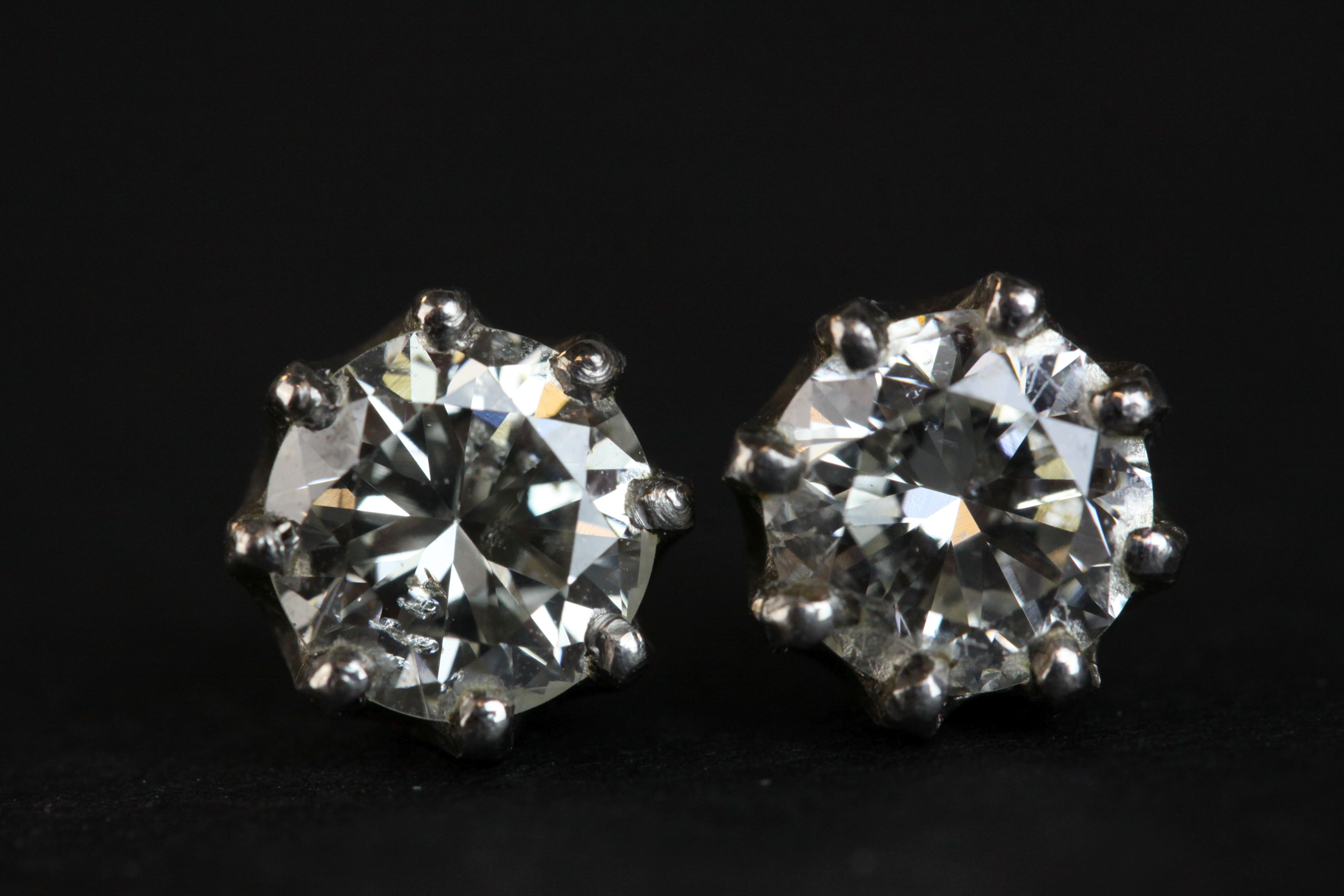 Pair of diamond solitaire stud earrings, each round brilliant cut diamond weighing approx 1.0 carat, - Image 4 of 8