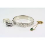 Silver hinged bangle, engraved floral and leaf design to upper half, makers Bravingtons Ltd,