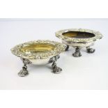 Pair of George III silver gilt open salt cellars, the feet modelled as fish, the broad border with