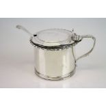 Silver drum mustard pot, cast border, crest to hinged lid, shell shaped thumb piece, reeded base,