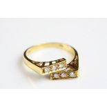 Diamond 18ct yellow gold crossover ring, each rectangular crossover shoulder set with three small