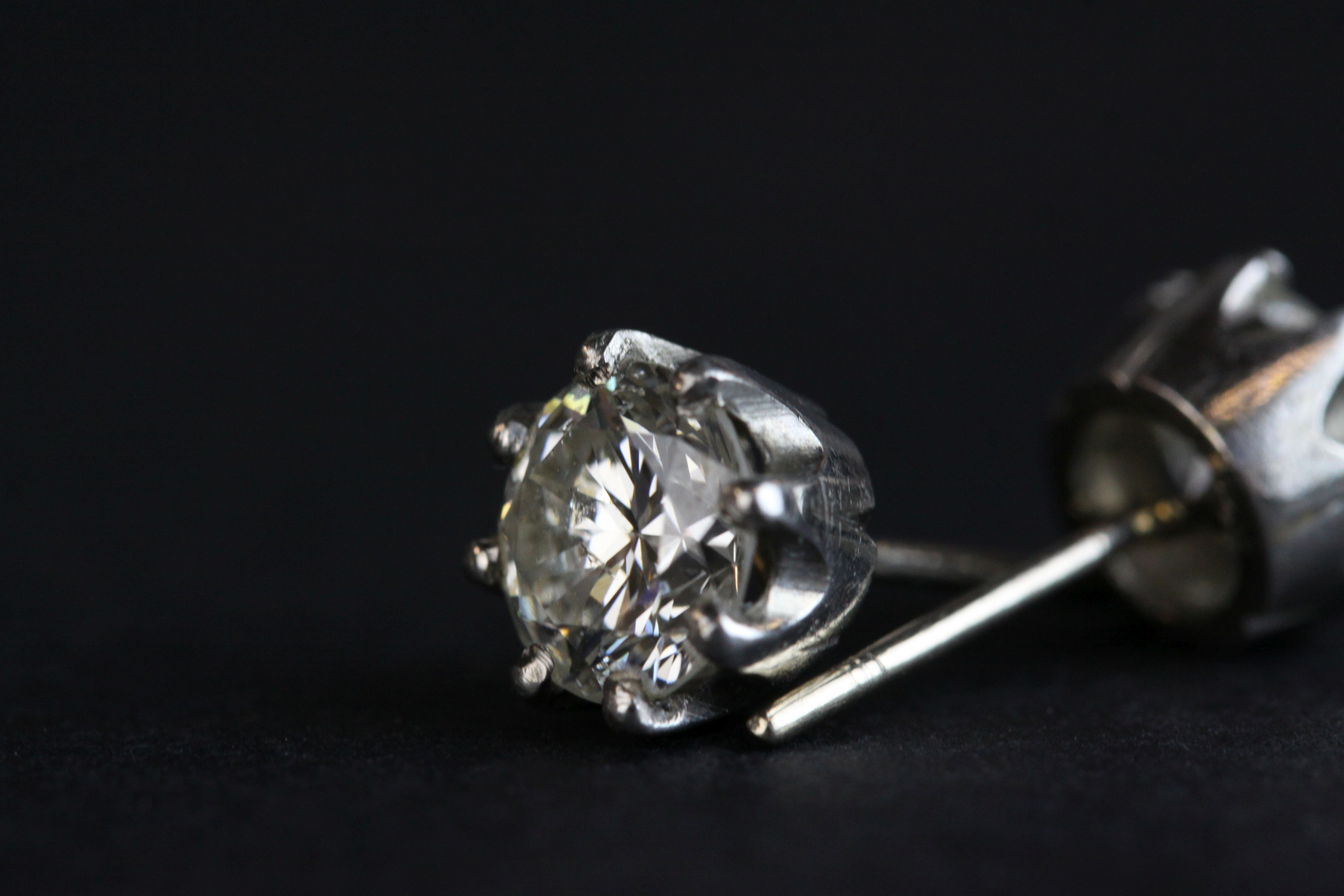 Pair of diamond solitaire stud earrings, each round brilliant cut diamond weighing approx 1.0 carat, - Image 7 of 8
