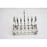 Victorian silver seven bar toast rack raised on four bun feet, makers Martin, Hall & Co, Sheffield